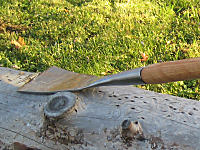 hand-forged slick on log